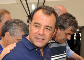 Cabral é levado para Bangu; grupo festeja chegada com fogos e espumante