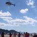 Helicóptero faz chover dinheiro em praia do Sul do Brasil
